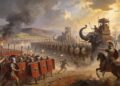 Reconstrucción artística de una batalla entre legionarios romanos y tropas de Pirro de Epiro. Se aprecia la formación cerrada romana con escudos rojos enfrentando elefantes de guerra con torres de mando. Legionarios lanzando proyectiles, humo y fuego en el campo de batalla. Muestra el conflicto militar entre disciplina romana y poder helenístico durante las Guerras Pirricas (280-275 a.C.).